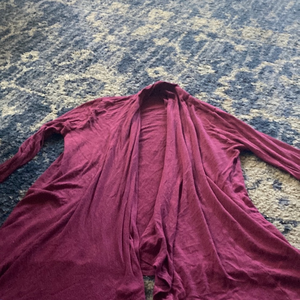 a maroon cardigan